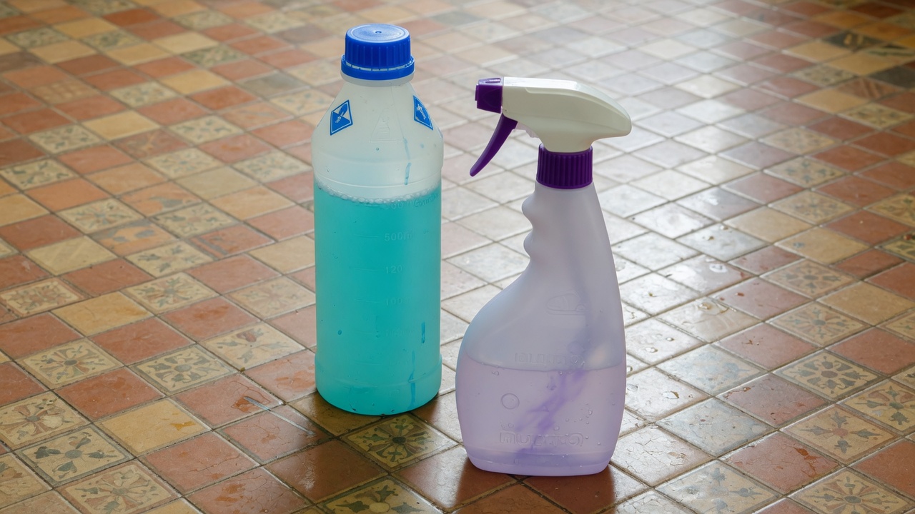 Floor cleaner concentrate beside a ready-to-use mop spray