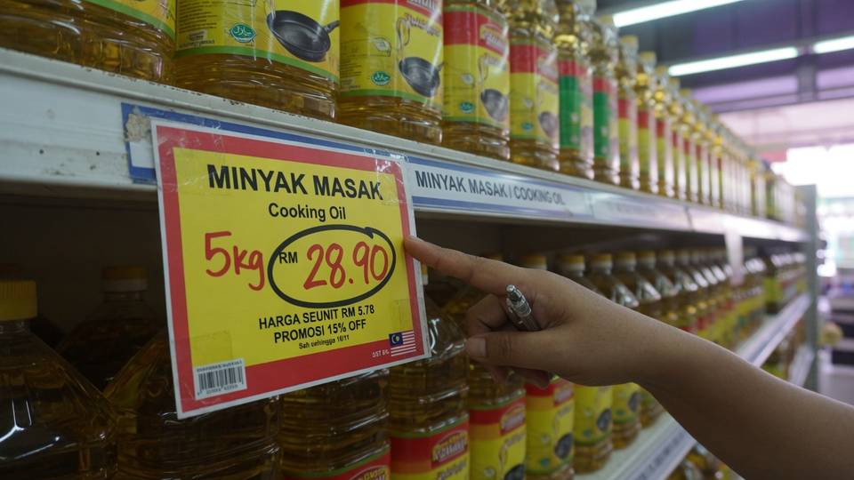 Checking supermarket shelf price tags carefully